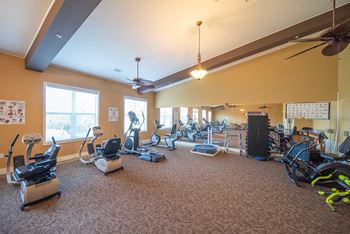 A spacious gym with a variety of exercise equipment.